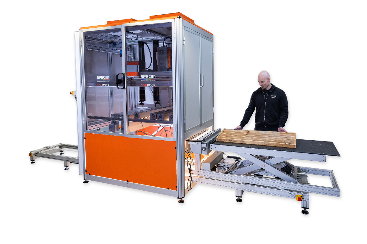 Person loading drill core box into sisurock workstation